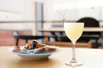 Simple cocktail and glass table decoration in restaurant