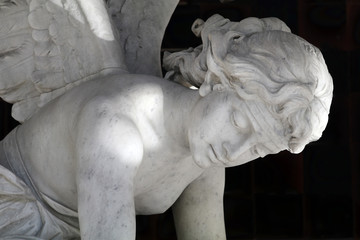 old sculpture of woman in bright sunlight