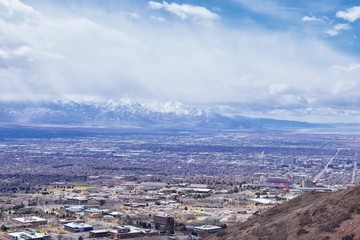 Salt Lake Valley and City panoramic views from the Red Butte Trail to the Living Room, Wasatch Front, Rocky Mountains in Utah early spring. Hiking view of trails around the University and Gardens and 
