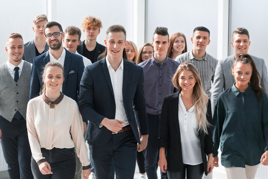group of ambitious young people walking in a new office
