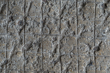 Cobblestone texture.Marble and granite drainage system closeup.Concrete wall with gravel. Gray foundation of the house.