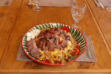 Pilaf rice with lamb on restaurant table
