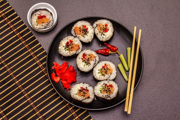 Korean roll Gimbap(kimbob). Steamed white rice (bap) and various other ingredients. Trendy black background
