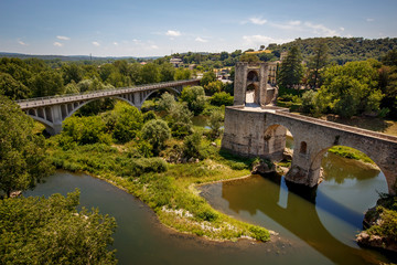 Fototapeta na wymiar Old bridge over the river Fluvia in medieval town of Besalu, province Girona, Spain