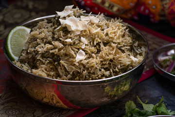 oringa and curry leaf rice pilaf in silver serving bowl