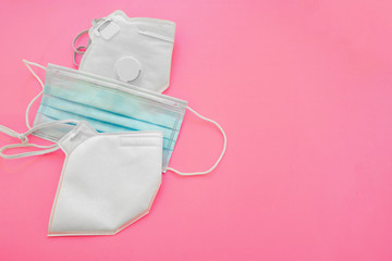 Surgical mask with rubber ear straps. Typical 3-ply surgical mask, masks pff2 and pff3 against covid. Procedure mask from bacteria. Protection concept.