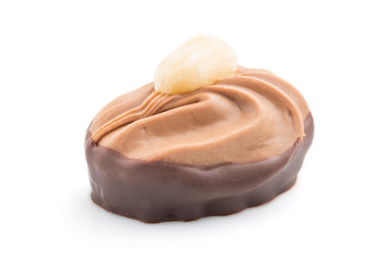 Single chocolate candy isolated on white background. side view.