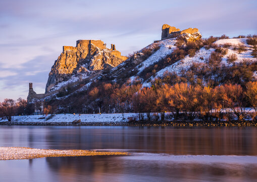 Snow Covered Devin Castle Ruins above the Danube River in Bratislava, Slovakia at Sunrise