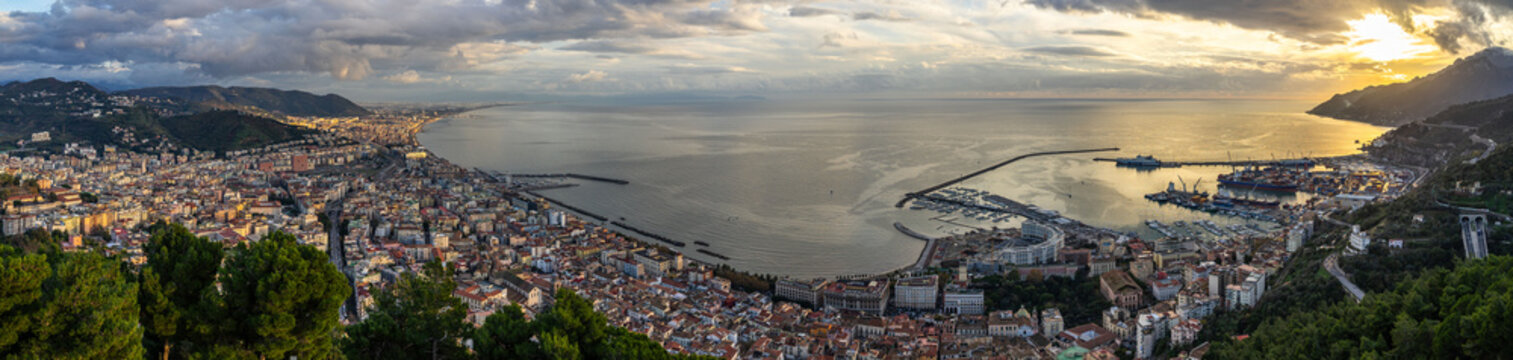 Wide panoramic view of Salerno and Gulf of Salerno seen from Arechi Castle at sunset, Campania, Italy