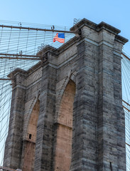 Obraz premium Brooklyn Bridge closeup with American flag on top