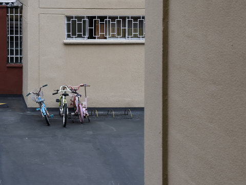 Some bikes parked in the unit seen from an apartment 