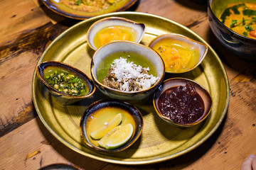 A set of bowls with different asian style dishes