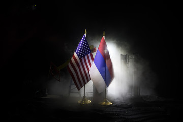 Business dialogue, oil agreement concept: National flags with Oil pump and oil refining factory at...