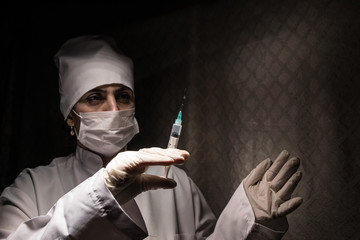 Scientist putting a sample in a test tube in a chemical laboratory