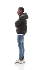 Naklejka premium side view. casual guy in jeans looking at copy space