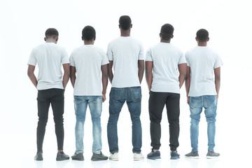 Obraz premium rear view. group of guys looking at white blank screen.