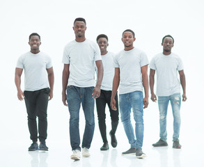 Obraz premium in full growth. a team of confident modern guys standing together