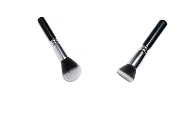 Professional makeup brushes isolated on a white background.