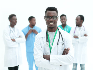 Fototapeta premium young confident doctor on the background of his colleagues
