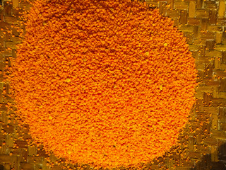 Red raw organic lentils texture. Food ingredient background. Color