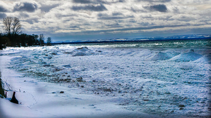 Winter shoreline covered in snow and ice 