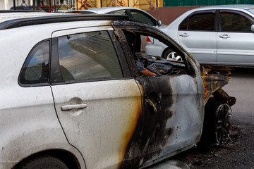 Part of the car after arson in a parking lot near the house. to illustrate an article about fire, banditry, an insured event, loss compensation.