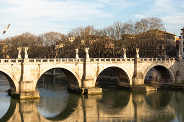Naklejka premium Ponte Sant'angelo. Pedestrian bridge over the Tiber, bridge of the Holy angel. The photo was taken in the spring of 2020.