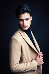 handsome asian fashion looking man posing in studio on black background, lifestyle modern people concept