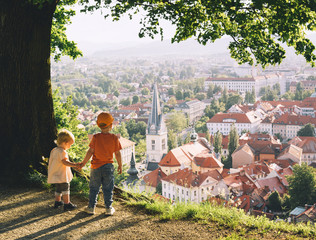 Little children on background of Ljubljana, Slovenia, Europe.