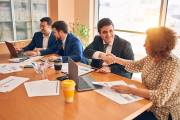 Business lawyers workers meeting at law firm office. Professional executive partners working on finance strategry at the workplace. Shaking hands for succesful agreement.