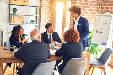 Group of business workers working together in a meeting. Listening one of them speaking at the office.
