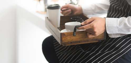 Barista makes coffee, pour coffee, serve coffee to customers.