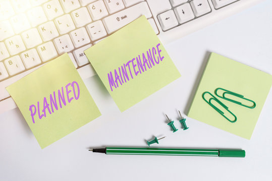 Conceptual hand writing showing Planned Maintenance. Concept meaning Check ups to be done Scheduled on a Regular Basis Empty note paper and paper clips with pencil on white background