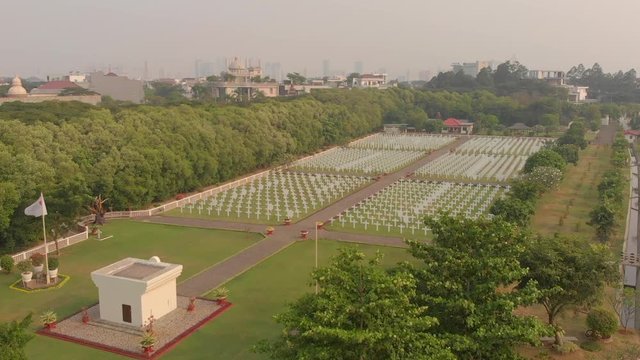 Amazing ascending over the historical Dutch War Cemetery at Ancol in Jakarta, Indonesia