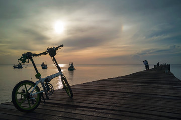 Fototapeta premium Morning view of the wooden bridge on the coast at Thap Sakae, Prachuap Khiri Khan, Thailand.
