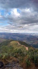 Fototapeta na wymiar paraglider over the mountains