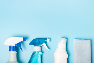 Detergent on a blue background, copy of space, the concept of spring cleaning