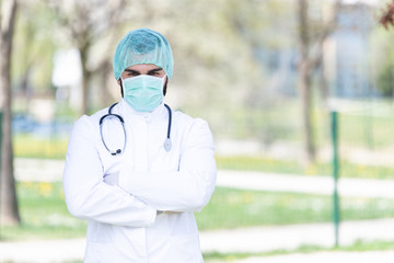 Doctor With Surgical Mask and Gloves Outside