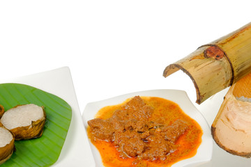 Lemang  and Rendang isolated on white background. Popular food for breaking fast during ramadan, Ramadan Food.