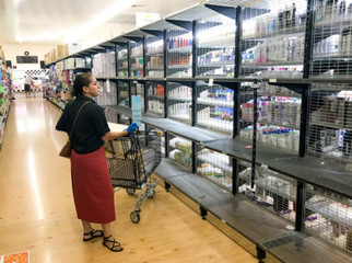 COVID-19 Outbreak. Image of Empty supermarket shelves amid panic buying during coronavirus shutdowns