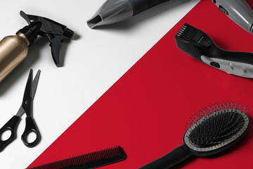 Malta flag with hair cutting tools. Combs, scissors and hairdressing tools in a beauty salon desktop on a national wooden background.