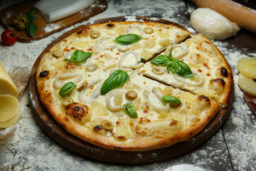 Italian squid pizza with olives and cheese