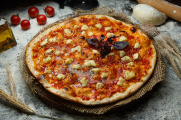 Italian pizza with mozzarella and tomato