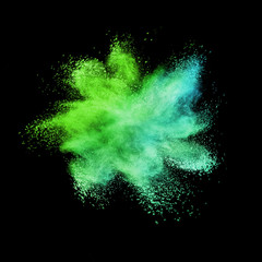 Abstract multicolored powder or dust splash on a black background.