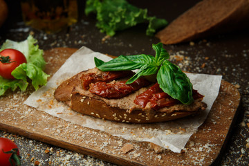 Bruschetta with chicken chop and tomatoes
