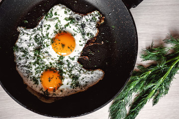 fried eggs with dill for breakfast. fresh and healthy morning breakfast