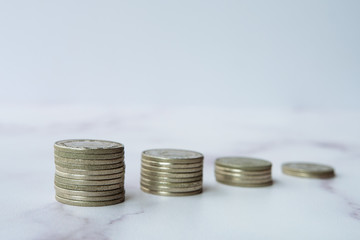 Growing money graph in a row of coins. Econimical crisis concept due to coronavirus COVID-19 spread in the world