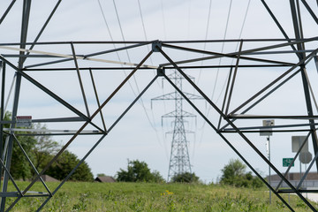 Electricity pylons in spring sunny day.