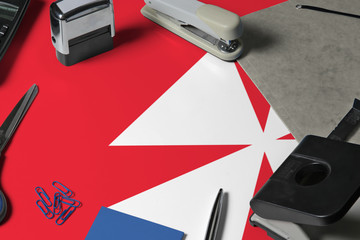 Wallis And Futuna flag with office clerk workplace background. National stationary concept with...