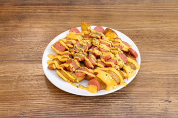 potatoes bravas with sausages